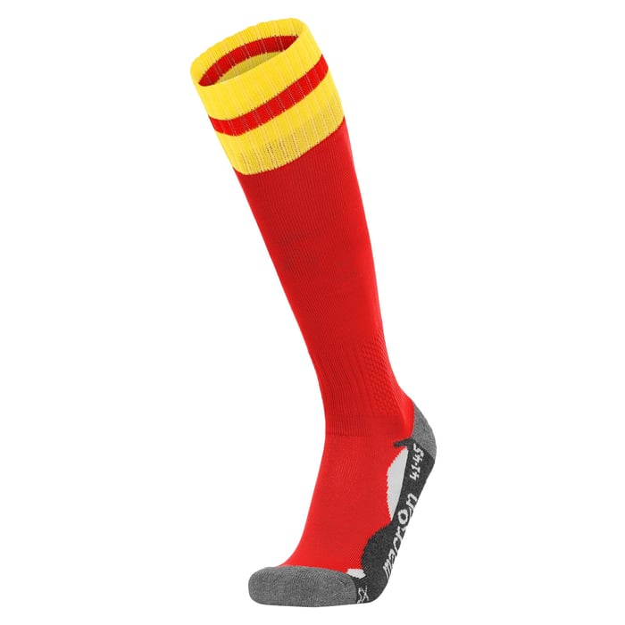 Red knee-high sock with yellow top on a white background