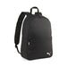 A black Puma Team Goal backpack with a logo on the front pocket and adjustable straps.