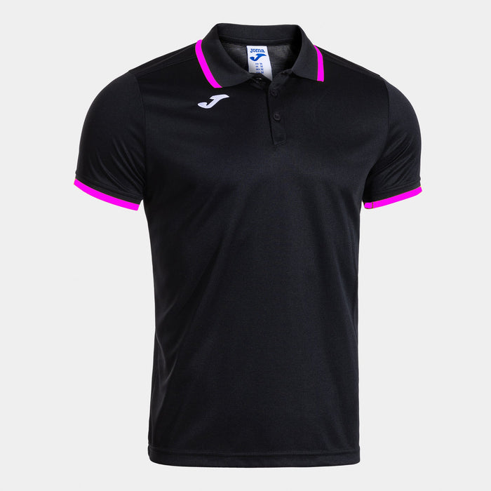 A short sleeve polo shirt in black with pink trimmings, featuring a collar and Joma brand logo on the chest.