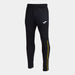 Joma Championship VIII Long Pants in black with yellow stripe along the left leg